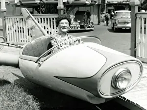 Old age pensioner Ellen Pert 101 years old rides in a fairground dive-bomber car ride