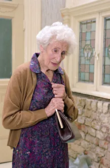 Old People Prints: Old age Pensioners Old people OAP OAPs Old Lady holding her handbag climbing steps