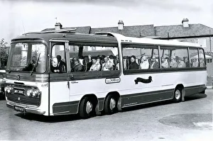 Men And Women Prints: Old age pensioners at Romford community centre leave for a free coach outing to Hampton