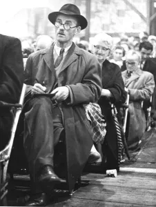 00101 Prints: An old gentleman looks up hopefully whilst marking his card during a Bingo session