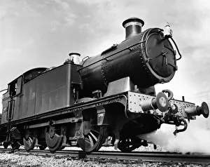 An old Leamington steam locomotive number 6697 being preapred for action at Didcot