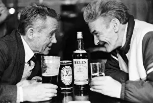 Whiskey Prints: Two old man in pub drinkers bottle of Bells whisky can glass of Guinness facing each