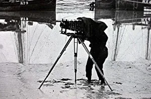 00186 Prints: OLD PHOTOGRAPH OF A PHOTOGRAPHER ON THE BEACH MARCH 2001 USING A PLATE CAMERA ON