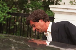 Oliver Hoare the man alleged to have had an affair with Princess Diana leaves for work