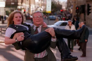 Oliver Reed actor star of film The Bruce lifting young blonde woman Karen Bruce in his