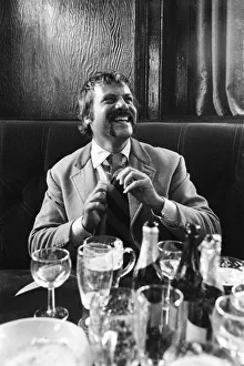 Oliver Reed, British actor, enjoys a few drinks at his local pub, The Dog and Fox