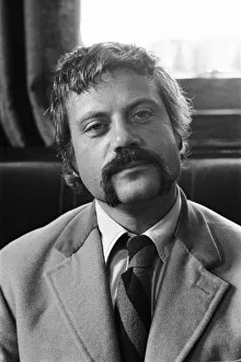 Oliver Reed, British actor, enjoys a few drinks at his local pub, The Dog and Fox