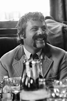 Oliver Reed, British actor, enjoys a few drinks at his local pub, The Dog and Fox
