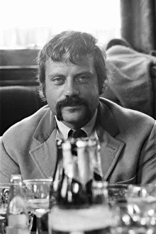 Oliver Reed, British actor, enjoys a few drinks at his local pub, The Dog and Fox