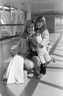 Olivia Newton John departing Heathrow Airport with her nephew Emerson. 23rd March 1979