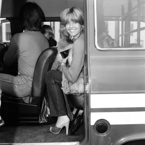 T Shirt Prints: Olivia Newton John leaving Heathrow Airport for Los Angeles. 9th June 1977