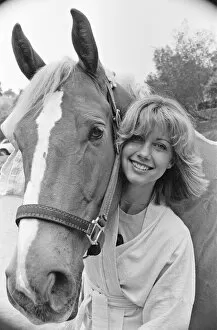 01060 Collection: Olivia Newton John, singer and actor, pictured at home in Malibu, California, America