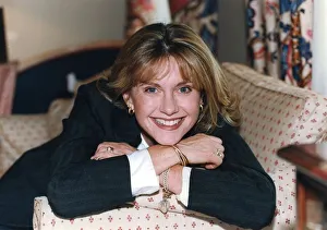 01478 Prints: Olivia Newton-John smiling during interview in London hotel - January 1995