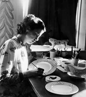 Ceramics Prints: Olwyn Cotgreave, aged 20, tracing in platinum the outline of the flower design on a