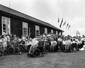 Disabled Prints: Olympic games'In wheel chairs. Flags of twelve nations fluttered from masts