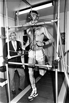 Exercises And Training Prints: Former Olympic gold medallist David Hemery looks on as Mark McMahon is put through his