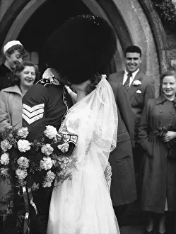 The onlookers were tickled pink at the sight of the tall Guards sergeant in the confetti