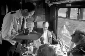 Serving Prints: Opera goers express to Glynbourne British Rail waiter serves tea in the Buffet car