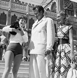 Man And Women Prints: Orson Welles actor director with Rosy Mazzacurati and Anne Casini relaxing in Venice