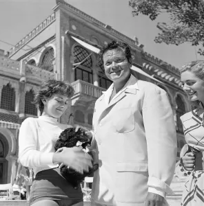 Puppies Prints: Orson Welles actor director and Rosy Mazzacurati relaxing in Venice September