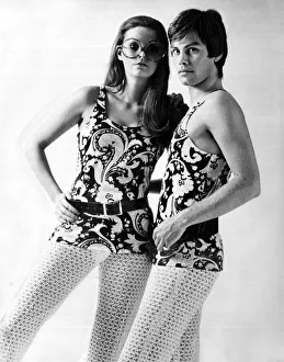 00196 Prints: His and hers outfits of flowery tank tops and open knit stockings January 1970