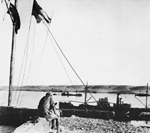 Libya Prints: Outside Navy House, Tobruk. Note sunken ship in background. Circa 1940s