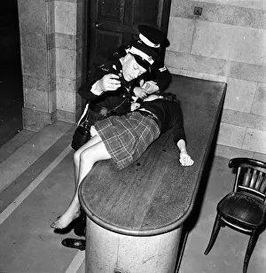 An over-excited female Beatles fan is attended to at a Sheffield concert by the St Johns