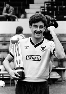 Moustaches Prints: Oxford United footballer John Aldridge holds the Second Division Championship trophy
