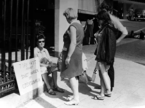 00177 Prints: Pacifist campaigner Pat Arrowsmith asitting on the kerb outside the gates of Kensington