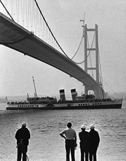 Suspension Bridge Prints: The paddle steamer Waverley passes under the Humber Bridge as it nears completion