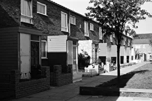 Social Housing Prints: Painted council houses and the unpainted ones - part of a battle of home buying at a