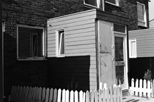 01083 Prints: Painted council houses and the unpainted ones - part of a battle of home buying at a