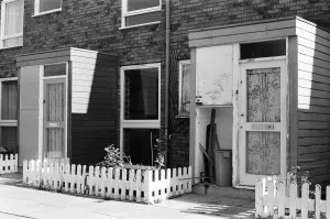Painted council houses and the unpainted ones - part of a battle of home buying at a