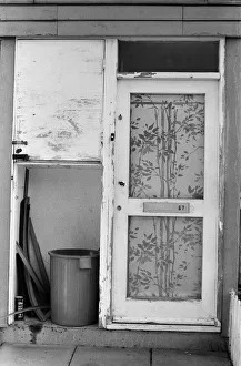 Painted council houses and the unpainted ones - part of a battle of home buying at a