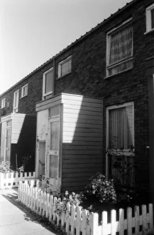01083 Prints: Painted council houses and the unpainted ones - part of a battle of home buying at a