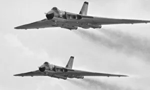 Formation Prints: A pair of Avro Vulcan bombers seen here taking part in the fly past at RAF Scampton