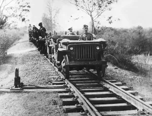 Far East Prints: A pair of Willys Jeeps adapted for running on railway tracks head southwards