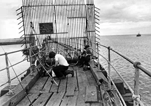 00088 Prints: A pair of young anglers prepare to enjoy a quite afternoon fishing on Blyth Pier