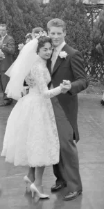 Pamela and David Moore lead the first dance in the rose garden at their reception