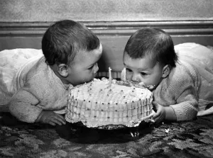 00053 Prints: Pamela (left) and Suzanne Nicholson tuck into their first birthday cake. P007068