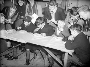 00151 Collection: Pancake Day Eating Competition February 1955 Schoolboys take part in an eating