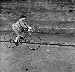 Newspapers Prints: Paperboy Alan Preston delivering the Daily Telegraph in Lytham St Annes, Lancashire