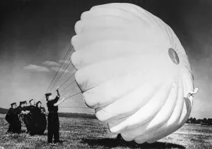 Parachute Prints: Parachute packers of the W. R. N. S. testing a parachute at a British Naval Air Station