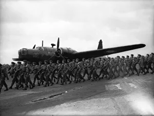 Paratroopers alongside a Vickers Wellington Bomber during WW2. Circa 1942