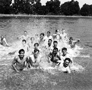 Paratroops from the US 6th Airborne Division enjoy a swim in a canal near the battlefront