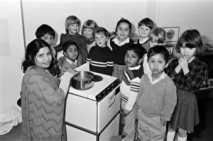 Minority Prints: Parent Mrs Rifat Khan demonstrates the art of Asian cooking to these youngsters at an