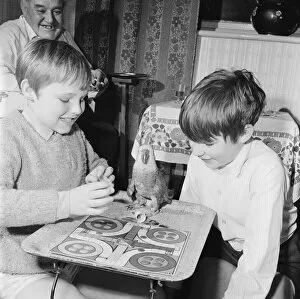 Images Dated 1st January 1972: Parrot plays Ludo with two boys. Circa 1972