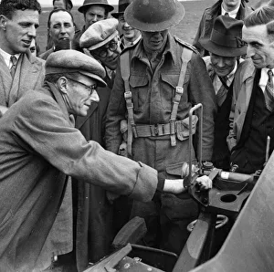 Munitions Prints: A party of factory workers recently visited an anti-tank regiment where they saw the guns