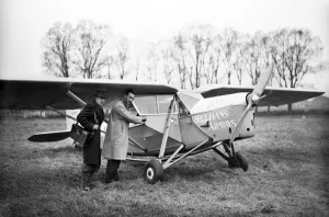 Passengers Prints: Passengers board a Hillmans Airways Puss Moth aircraft. 18th March 1932