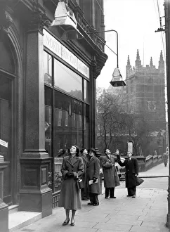 00101 Prints: Passers-by looking up at the gas heaters outside the Northern Gas Board showrooms in
